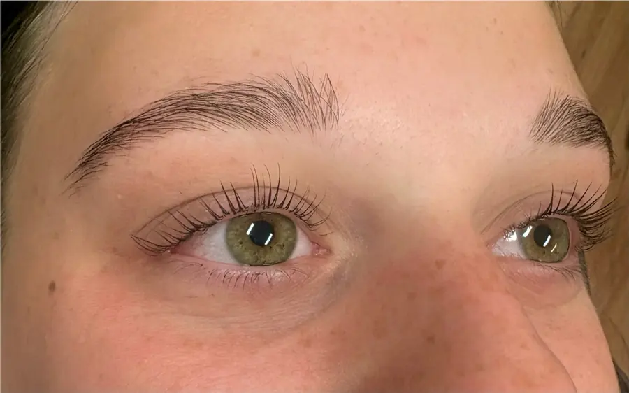 The same client’s lashes lifted and curled after a lash lift
